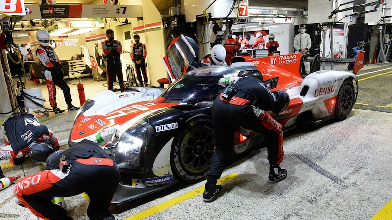 Mechanics work to service and  refuel the Toyota car of Argentine driver Jose Maria Lopez. Photograph via Getty Images