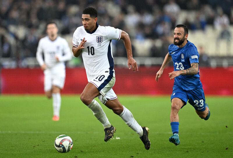 England's Jude Bellingham in action against Greece's Manolis Siopis during the UEFA Nations League match at Athens Olympic Stadium on November 14th. Photograph: Justin Setterfield/Getty Images