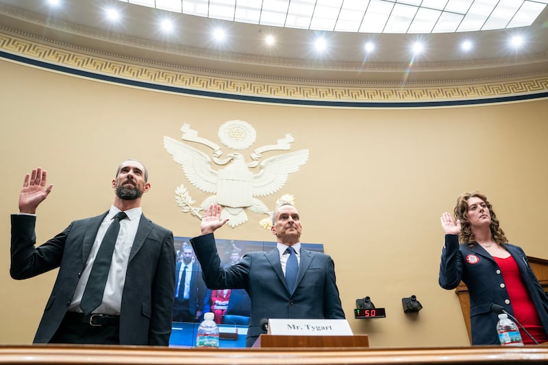 Usada chief executive Travis Tygart (centre) with former US Olympians Michael Phelps (left) and Allison Schmitt at a US Oversight and Investigations Subcommittee hearing on anti-doping measures ahead of the Paris Olympics. Photograph: Nathan Howard/Getty Images