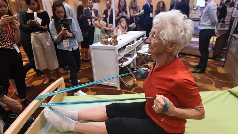 The worlds oldest gymnast Johanna Quaas, (92), of Germany demonstrates strengthening exercises on a special bed for the elderly during the 8th International Ageing Asia Innovation Forum in Singapore earlier this year.