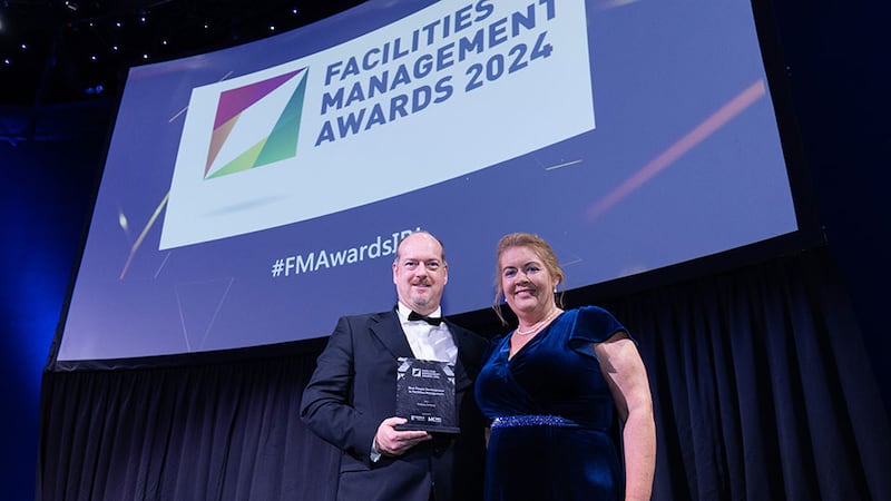 Bernard MacOscair, managing director of Berka Solutions and McKeon Group, presents the best people development in facilities management award to Lynn Carson, Sodexo Ireland