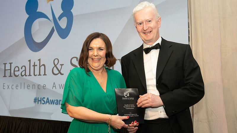 Yvette Moffatt, awards judge, presents the Health & Safety Excellence Award - Construction to Martin Gallagher, Surecom