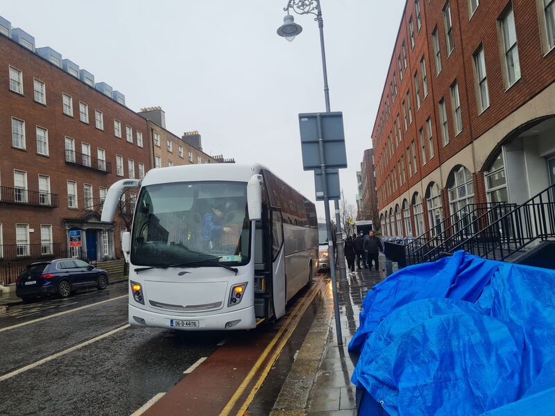 Coaches arrived today to bring men camping at Mount Street in Dublin city centre away. Photograph: Kitty Holland