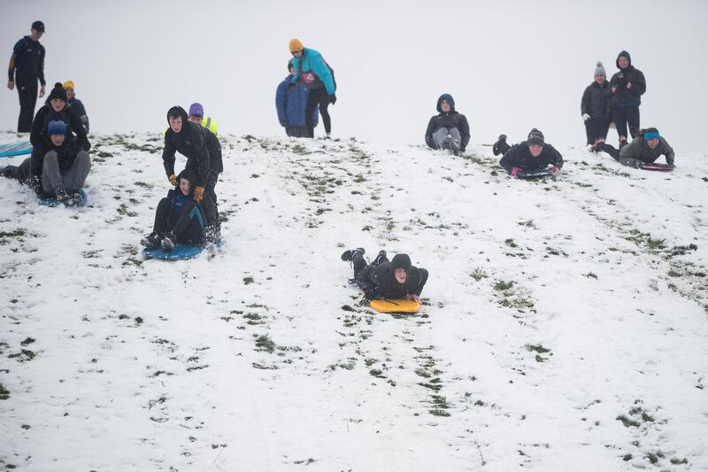 Teenagers having fun on sleds and bodyboards in the snow at Lissycasey, Co Clare on Thursday. Photograph: Eamon Ward