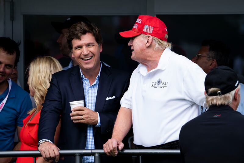 Fox News presenter Tucker Carlson and former US president Donald Trump at Trump National Golf Club in Bedminster, New Jersey, last July. Photograph: Doug Mills/New York Times