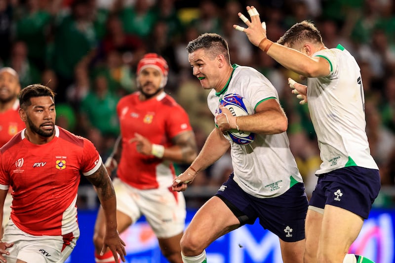 Garry Ringrose steps out of the way as Sexton heads for the line against Tonga. Photograph: Dan Sheridan/Inpho