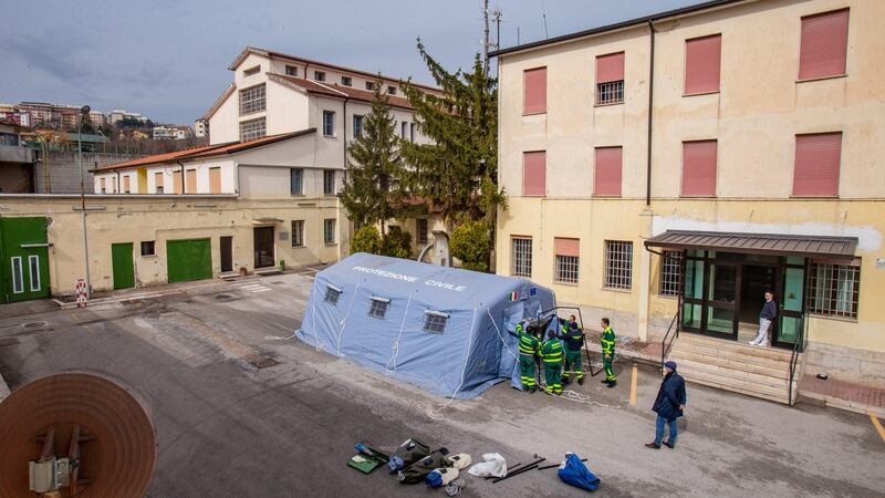 A tent for the preliminary medical examination of detainees is set up next to the prison in Potenza, southern Italy. Photograph: Tony Vece/EPA