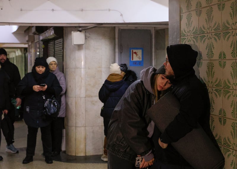 Locals take shelter in an underground crossing near the site of a glide bomb attack on a residential building in Kharkiv, Ukraine. Photograph: Sergey Kozlov/EPA