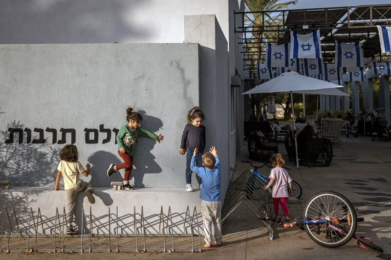 Children who survived the Hamas attack on Kfar Aza play near the hotel where they are living in Shefayim, Israel, this month. Photograph: Avishag Shar-Yashuv/New York Times
                      