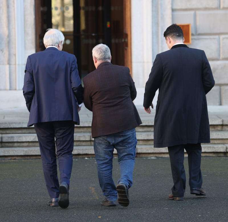 Members of the Regional Independent TD Group, which will be part of the next government, Michael Lowry, Barry Heneghan and Kevin 'Boxer' Moran leave Leinster House after their lunchtime doorstep on January 15th.  Photograph: Bryan O’Brien / The Irish Times