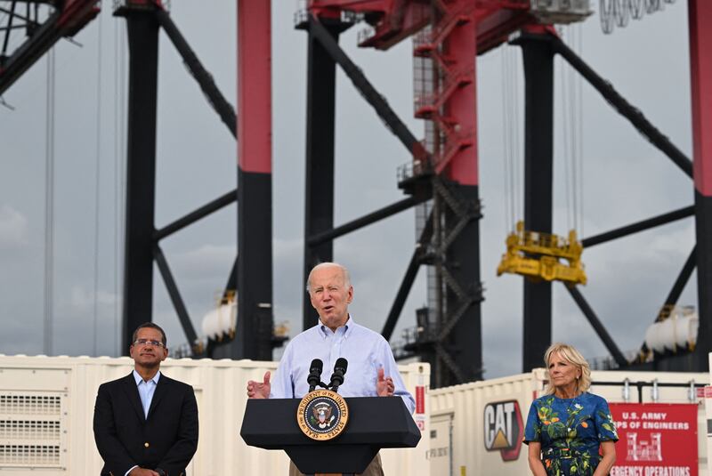 US President Joe Biden, flanked by First Lady Jill Biden and Puerto Rico Governor Pedro Pierluisi, speaks in the aftermath of Hurricane Fiona in Ponce, Puerto Rico, on October 3rd, 2022. Photograph: Saul Loeb/AFP via Getty Images