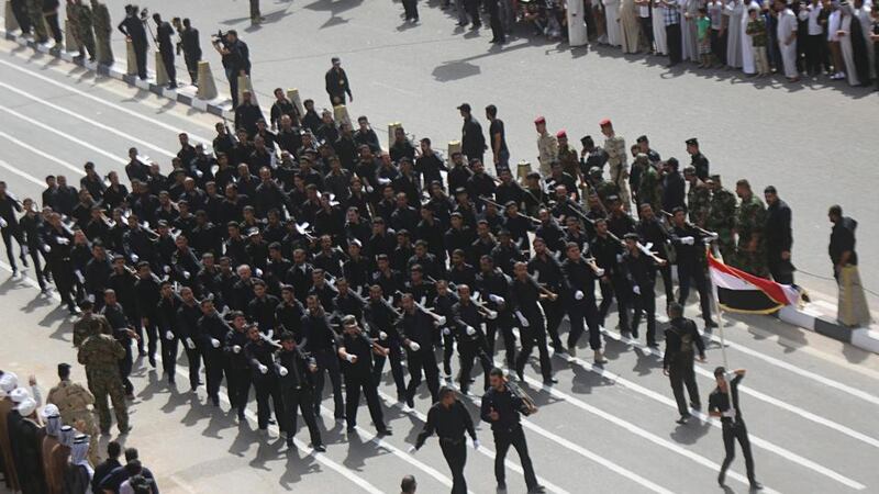 Mehdi Army fighters loyal to Shia cleric Moqtada al-Sadr march during a parade in Najaf, Iraq. Photograph: Ahmad Mousa/Reuters