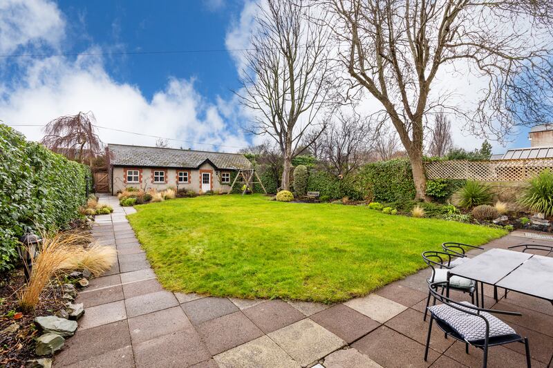 Rear garden with garden room