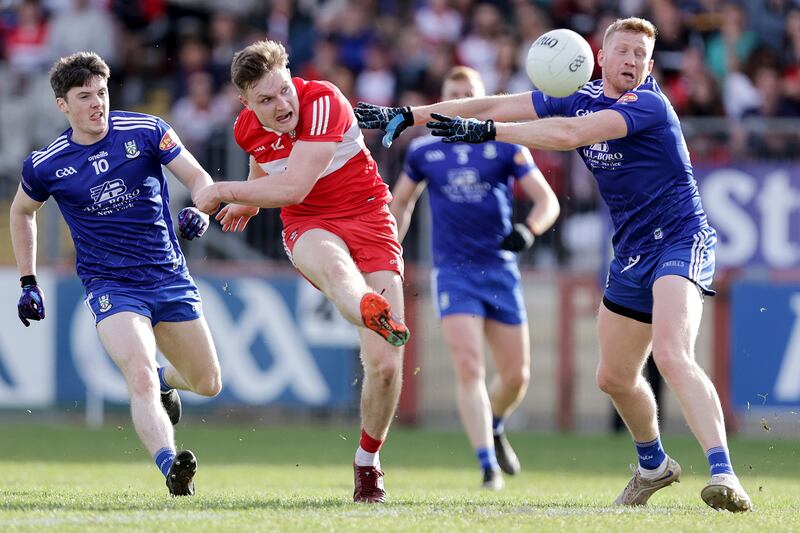 Derry's Ethan Doherty scores a point despite Kieran Hughes of Monaghan during the Ulster SFC semi-final at O'Neill's Healy Park. Photograph: Laszlo Geczo/Inpho
