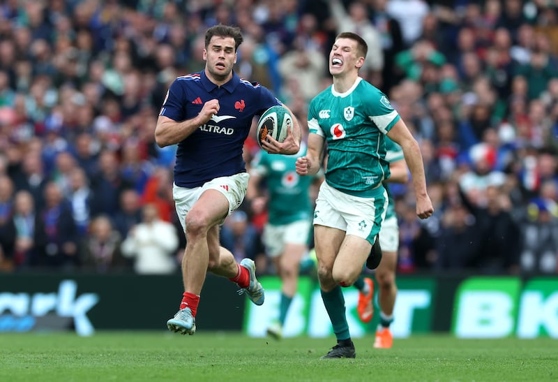 Damian Penaud runs away from Ireland's Sam Prendergast to score France's fifth try and complete an unanswered scoring spree of 34 points by the visiting team. Photograph: David Rogers/Getty Images