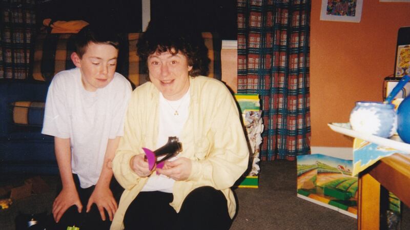 Shane  with him mother  when he was aged between 10 and 13