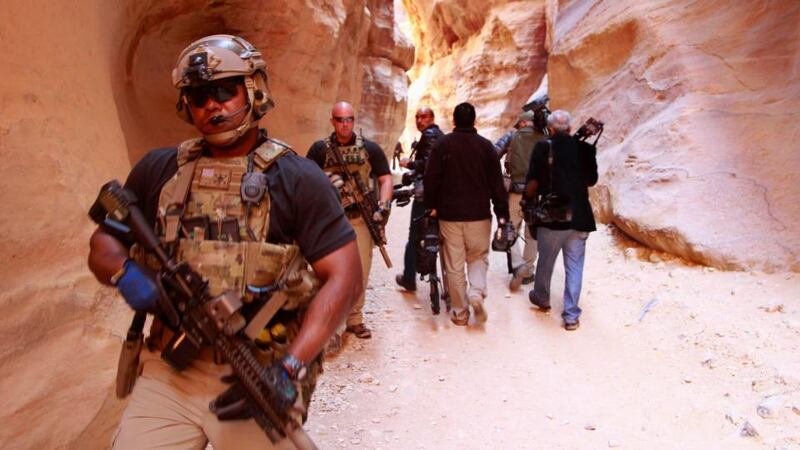 Members of the US  Secret Service Counter Assault Team survey a path after US pPresident Barack Obama walked through it during his tour of the ancient historic and archaeological site of Petra. Photograph: Muhammad Hamed/Reuters