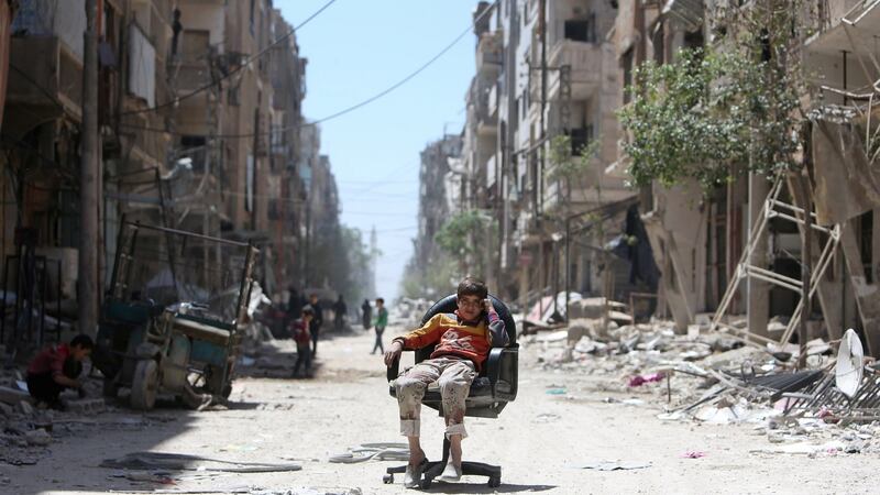 A bomb-damaged Douma street in the wake of air strikes. Photograph: Ali Hashisho/Reuters