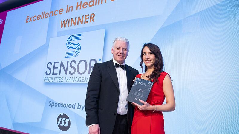 Eric Doyle, managing director at ISS Facility Services Ireland, presents the Excellence in Health & Safety award to Nicola Bell, Sensori Facilities Management.