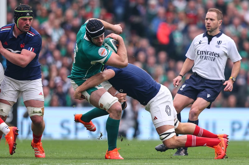 Ireland's Caelan Doris is tackled in the game against France. Photograph: Ben Brady/Inpho