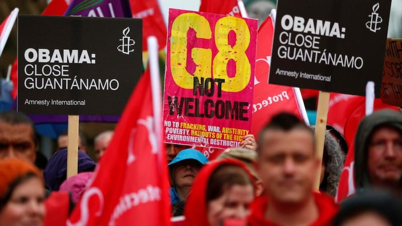 People take part in a demonstration against the upcoming G8 summit in Belfast today. Photograph: Yves Herman/Reuters