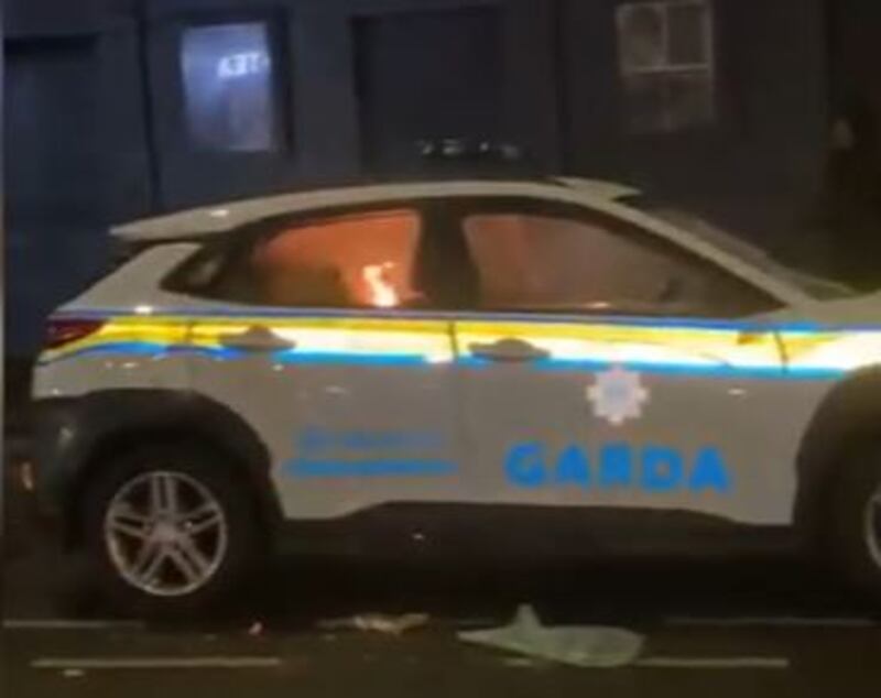 The Garda car set alight during the Dublin riots in November 2023