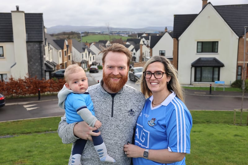 Emma Morgan, originally from Skerries, Co Dublin, pictured with her husband Joe and seven-month-old son James, in Hillcrest estate, Newry. Photograph: Dara Mac Dónaill







