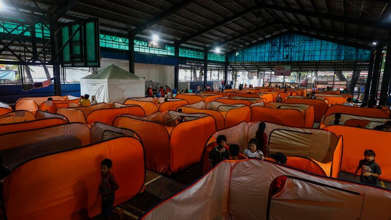 Tents are set up for typhoon evacuees at a gymnasium, turned into an evacuation center, in Quezon City, on Sunday. Photograph: EPA