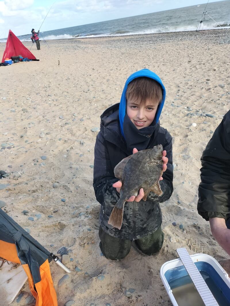 Evan Mason with the longest flounder of the day at 33cm.