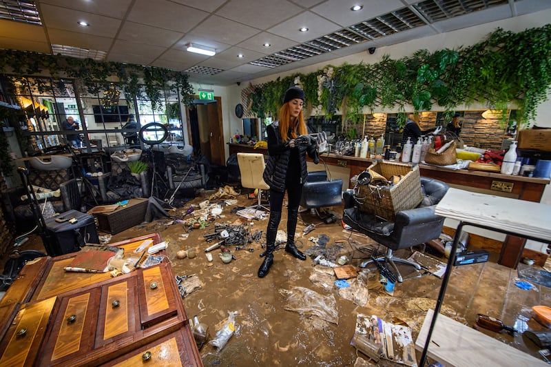 Rosaleen O’Donnell surveys her destroyed hair salon in Midleton, Co Cork, after flooding caused by Storm Babet. Photograph: Dan Linehan