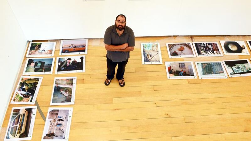 Yehuda Shaul of Breaking the Silence, a group of former Israeli soldiers who served in Gaza and the West Bank, with an exhibition of photographs taken by Israeli soldiers, at the Gallery of Photography in Dublin. Photograph: Eric Luke