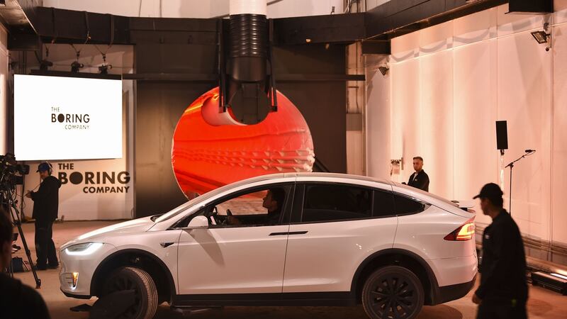 A modified Tesla  Model X  prepares to enter the tunnel at the unveiling event. Photograph: Bloomberg