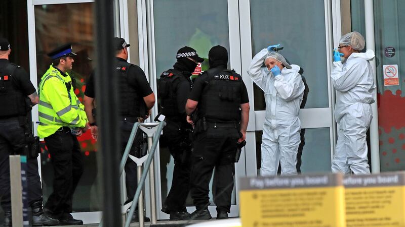 Police and forensic officers outside the Arndale Centre in Manchester  after a stabbing incident. Photograph: Peter Byrne/PA Wire