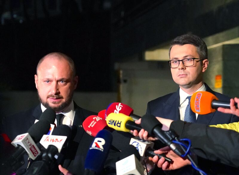 Head of the office of national security, Jacek Siewiersk and Polish government spokesman Piotr Muller make a statement after a crisis meeting in Warsaw following the deaths of two people from an explosion. Photograph: Janek Skarzynski/Getty Images