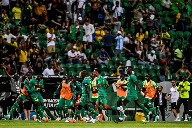 Senegal players celebrate after Senegal's forward Sadio Mane scored during the international friendly football match between Brazil and Senegal at the Jose Alvalade stadium in Lisbon. Photograph: Patricia de Melo Moreira/AFP via Getty Images