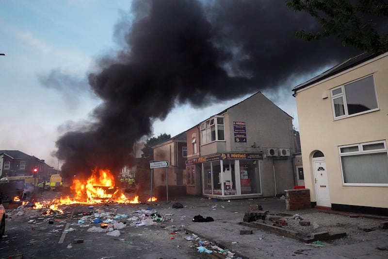 Debris burns during the riots last July 30 in Southport. Photograph: Getty Images