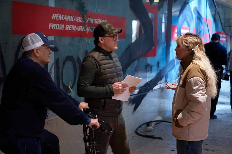 The Electric State: Joe and Anthony Russo and Millie Bobby Brown on set. Photograph: Paul Abell/Netflix