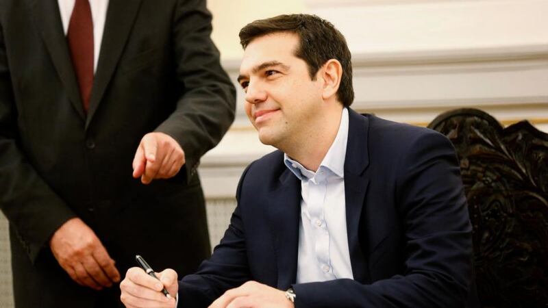 ‘Within an hour of Alexis Tsipras’s swearing in, the busy folk in the rating agency Standard and Poor’s were already suggesting it would downgrade Greece. Perhaps what they meant to say to that suffering people was a heartfelt “good luck”.’ Above, Tsipras  signs papers appointing him as Greece’s first leftist prime minister after his swearing-in ceremony at the presidential palace in Athens on  January 26th. Photograph: REUTERS/Yannis Behrakis