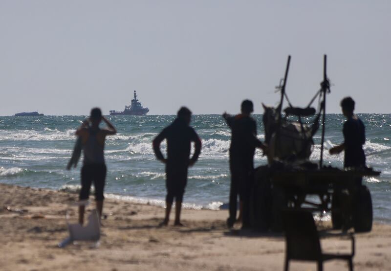 An Open Arms aid group vessel approaches the shores of Gaza towing a barge with 200 tons of humanitarian aid earlier in March. Photograph: Mohammed Hajjar/AP