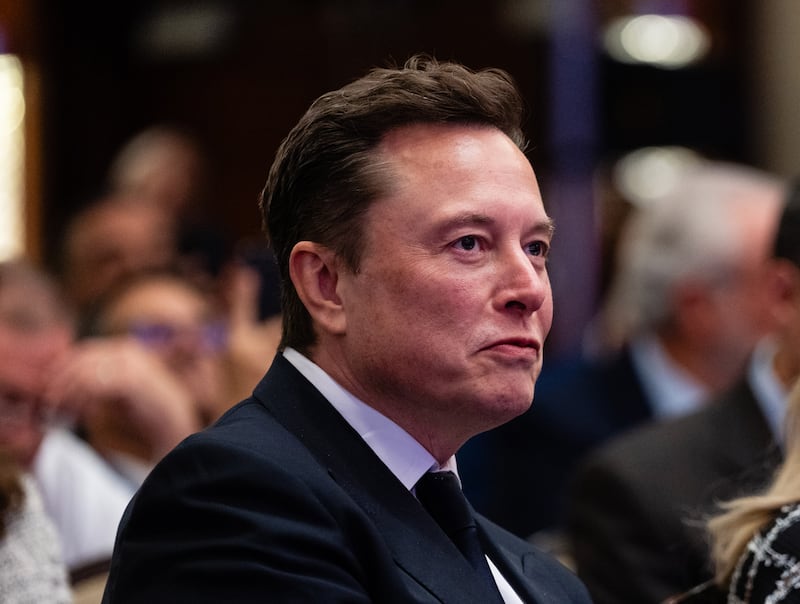 Elon Musk watches as US president-elect Donald Trump addresses House Republicans in Washington. Photograph: Eric Lee/The New York Times
                      