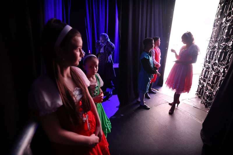 Chloe Kinch (right) speaks to Conor O'Brien and Callum Lennon as they and fellow performers prepare to go on stage at the National Stadium in Dublin for Beauty and the Beast. Photograph: Bryan O’Brien