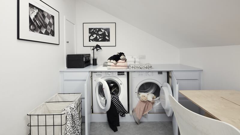 Multifunctional room ideas: Spare attic  room turned into home office,storage and laundry room. Photograph: Philip Lauterbach