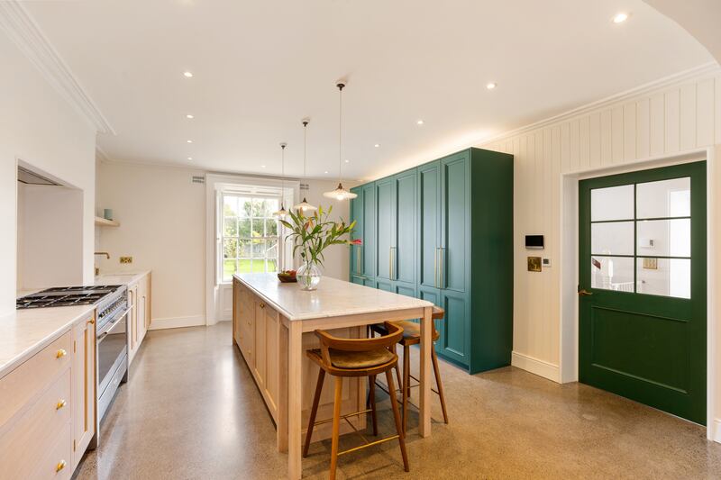 The kitchen: All the floors at garden level are done in polished concrete with underfloor heating, and the effect is one of solid, warm comfort.