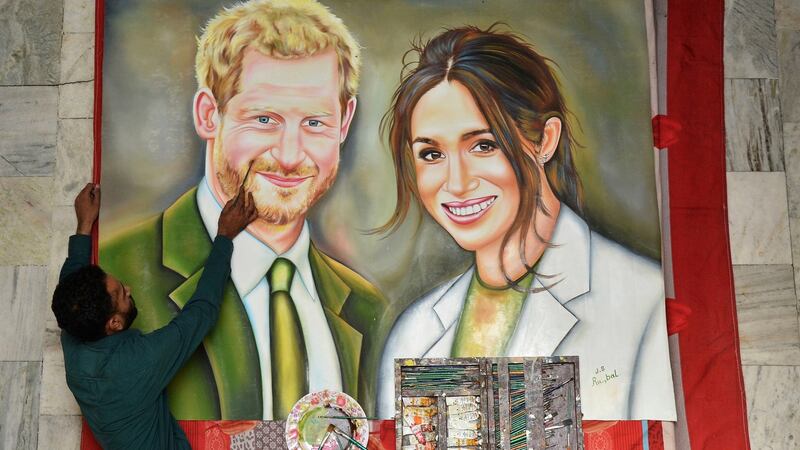 Indian artist Jagjot Singh Rubal puts the  final touches to a painting of  Prince Harry and Meghan Markle, which he plans to send as a gift for their wedding, in Amritsar, India, on Friday.  Photograph: Prabhjot Gill/AP