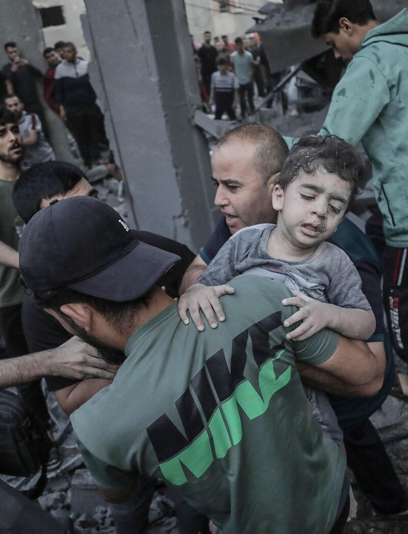 A child is recovered from the rubble of a residential building leveled in an Israeli airstrike, in Khan Younis refugee camp in the southern Gaza Strip on October 19th, 2023. Photograph: EPA-EFE