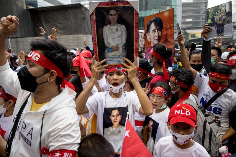 Protesters hold images of detained leader Aung San Suu Kyi during a demonstration outside the embassy of Myanmar in Bangkok. Photograph: Jack Taylor/AFP