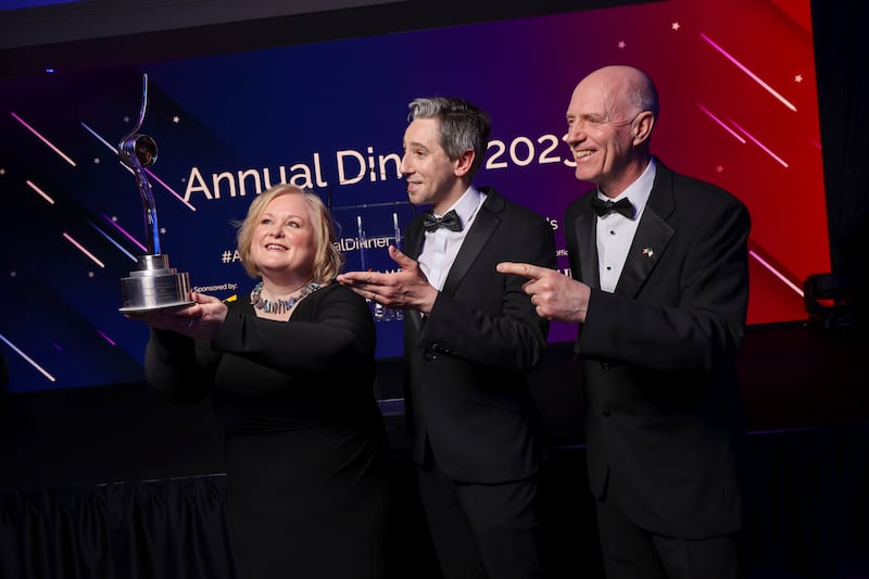 Lorna Martyn, senior vice president of technology, Fidelity Ireland, accepts the global leadership award, with Minister Harris and Seamus Fives, president, American Chamber of Commerce Ireland.
Photograph: Chris Bellew/Fennell Photography