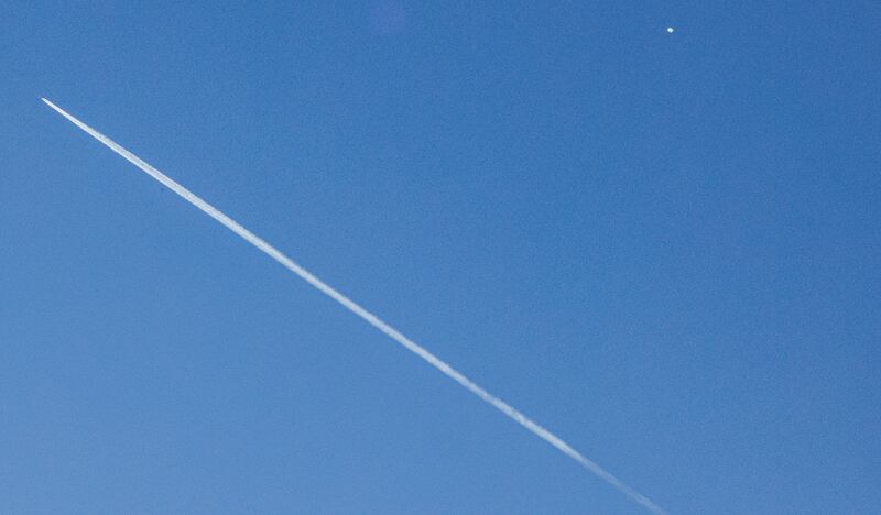 A commercial jet leaves a contrail as a high-altitude balloon, which the US government has stated is Chinese (top right), passes across the northern United States over Charlotte, North Carolina, Saturday, February 4th, 2023. Photograph: Nell Redmond/Shutterstock/EPA