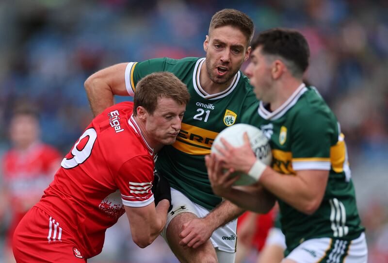 Derry’s Brendan Rogers and Adrian Spillane of Kerry. Photograph: James Crombie/Inpho