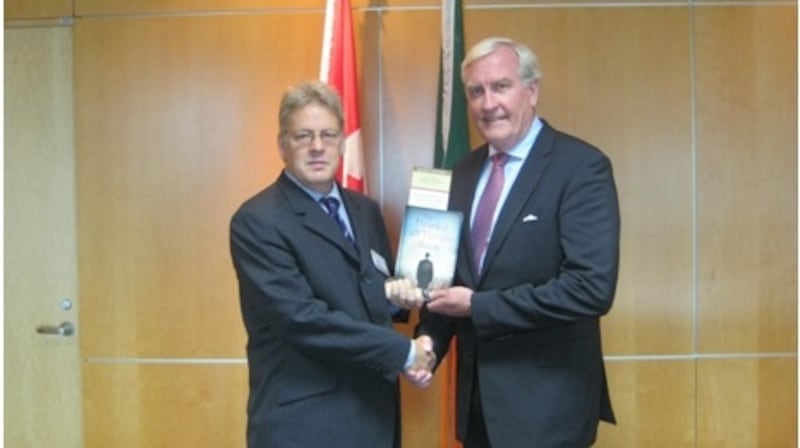 Dr Jason King presents a copy of Michael Collins’ The Death of All Things Seen to Kevin Michael Vickers, Canada’s Ambassador to Ireland